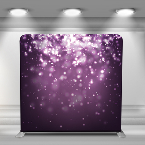 Purple glitter falling on dark background
